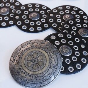 Belt (unbranded) Black faux leather medallion Silver tone rivets.